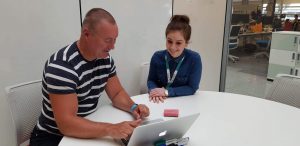 Chloe Walker and her mentor Dave Hatch working together on a laptop