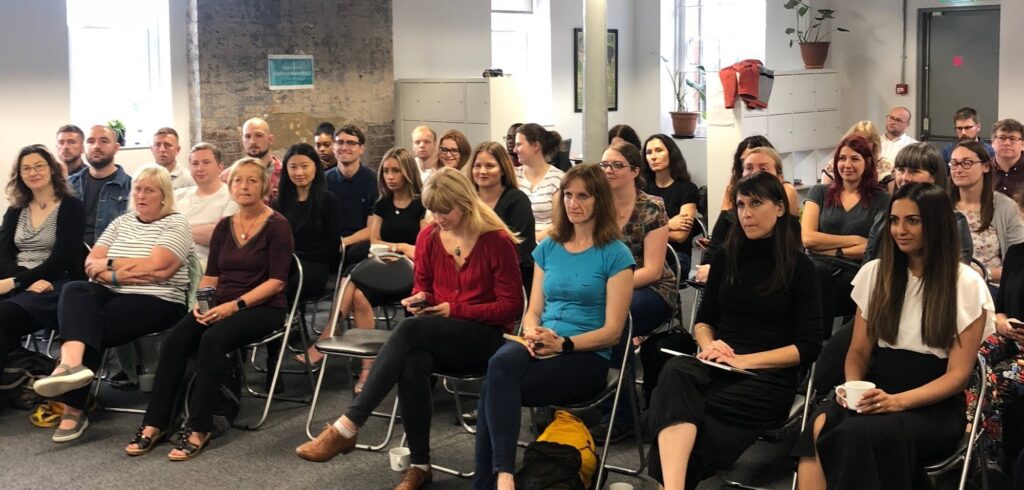 Animated audience members at the User Research Conference