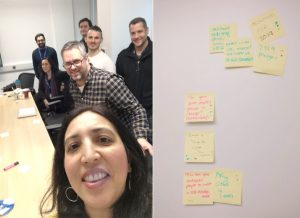 Seven people in a selfie shot and a wall of sticky notes from the session