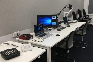 Desks with equipment in the London research lab