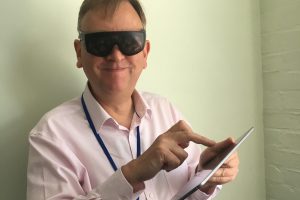 Trying goggles that simulate different visual impairments in the London Empathy Lab
