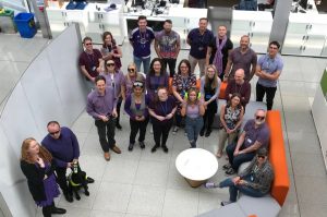 Employees of Newcastle wearing purple