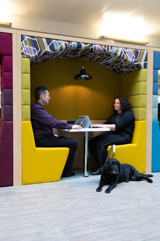 Alt text – HMRC colleagues sat within a breakout area at a Regional Centre